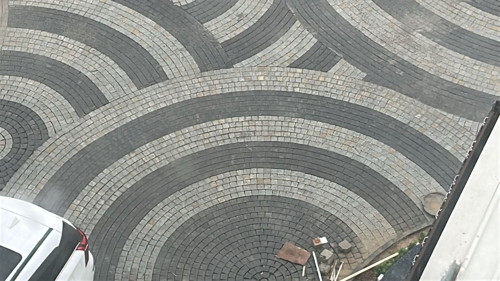 Durable natural granite cobbles hand-laid on high-traffic residential pathways