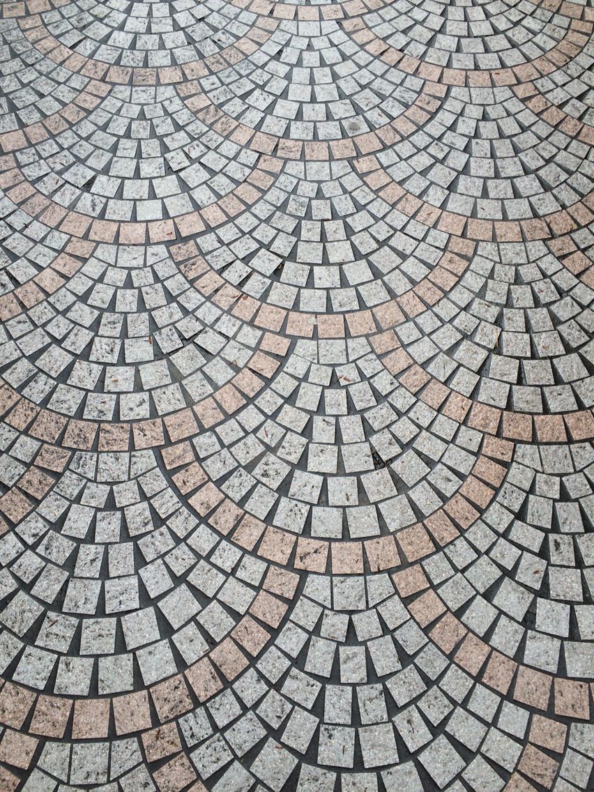 Interlocking granite stone pavers on mesh framework backing sheets